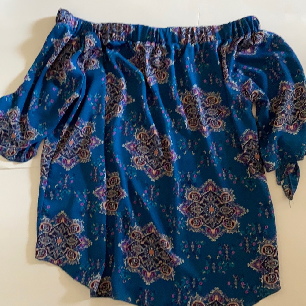 Cute off shoulder blue blouse.